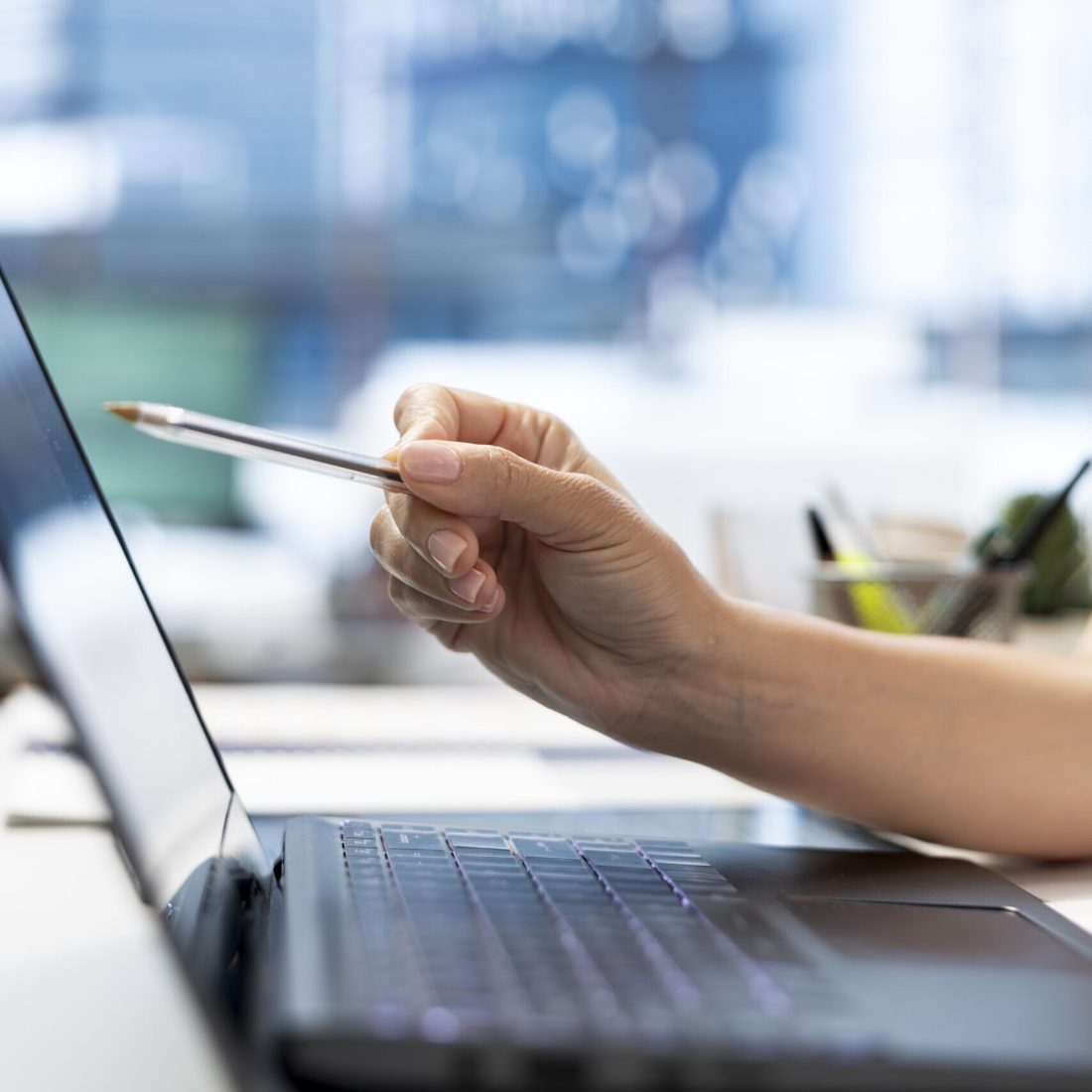 HR department worker using laptop to do background checks for potential job applicants. Close up of employer using notebook to implement recruiting strategies to attract qualified candidates